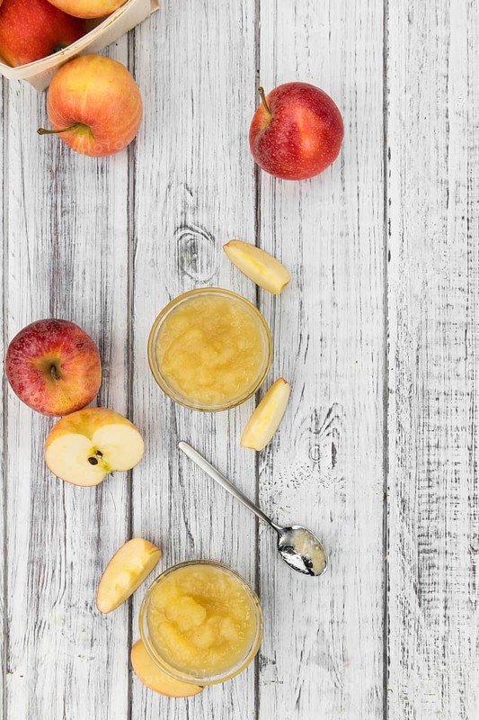 Old wooden table with fresh made Applesauce (selective focus, close-up shot)