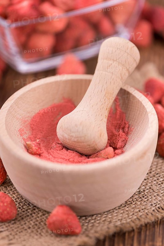 Fresh made Strawberry powder on a vintage background as detailed close-up shot