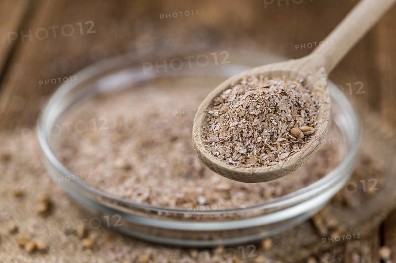 Portion of Wheat Bran as detailed close-up shot, selective focus