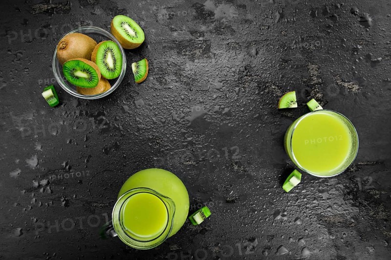 Kiwi Smoothie (selective focus) on an old and vintage background (homemade)