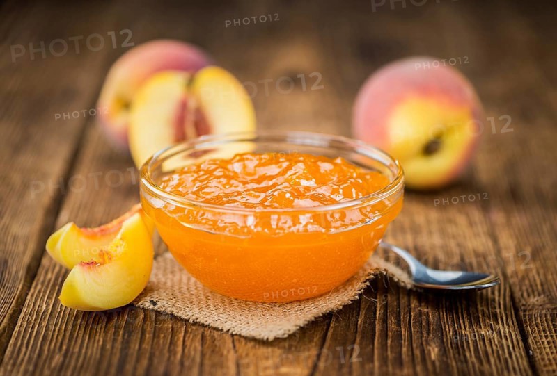 Peach Jam on a vintage background as detailed close-up shot, selective focus