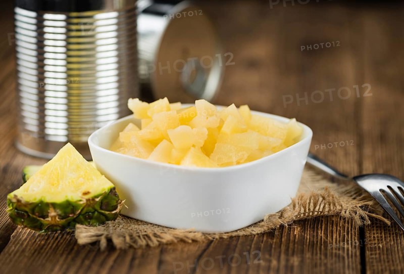 Portion of fresh Preserved Pineapple pieces close-up shot, selective focus