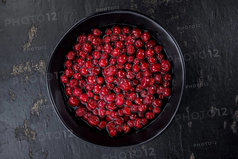 Portion of healthy Cranberries (preserved) (selective focus, close-up shot)