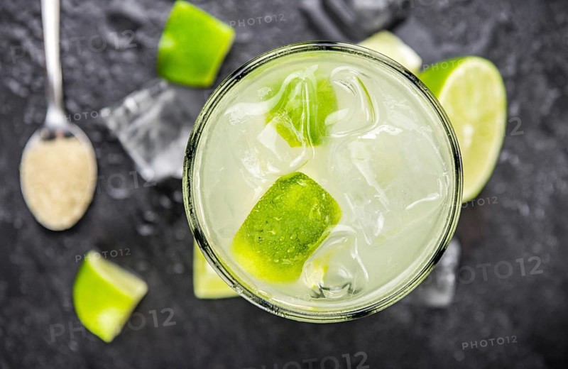 Slate slab with Caipirinha (selective focus, close-up shot)