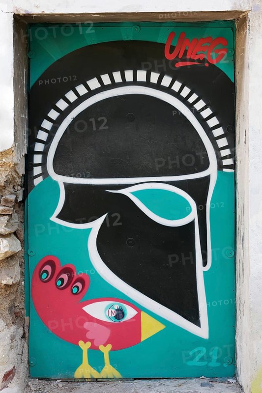 Greek helmet and bizarre bird, graffiti by street artist Uneg, Plaka historic centre, Athens, Greece, Europe