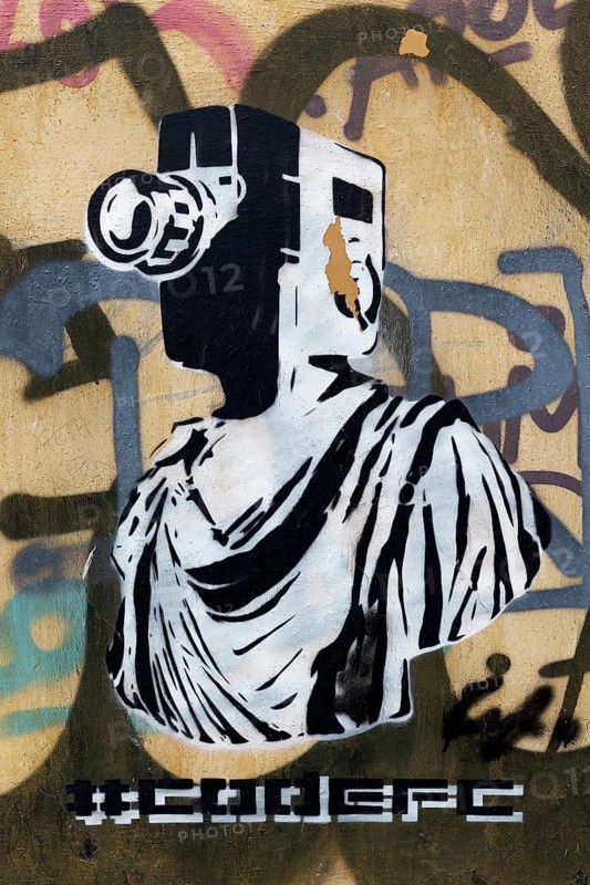 Greek statue with film camera as head, graffiti by street artist Goin, Plaka Old Town, Athens, Greece, Europe