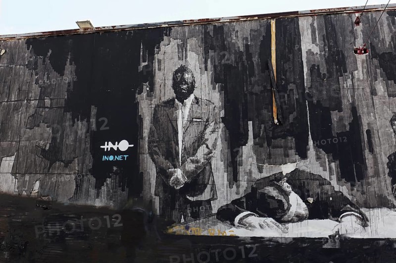Last Supper in Athens, man sleeping with his head on the table, mural in black and white by Greek street artist INO, Gazi neighbourhood, Athens, Greece, Europe