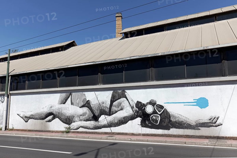 Reclining woman in bikini with diving mask, surreal mural in black and white by Greek street artist INO, Gazi neighbourhood, Athens, Greece, Europe