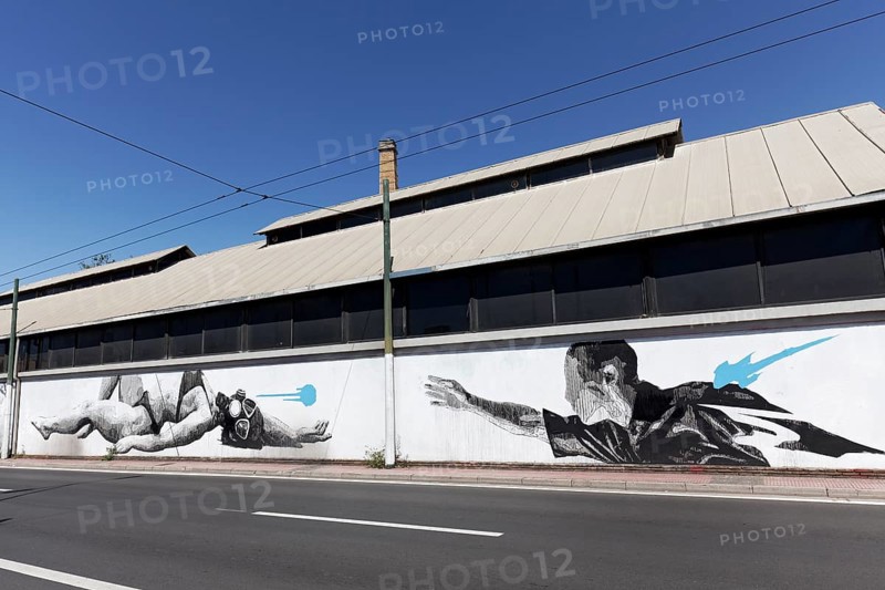 Man reaching for woman in bikini with diving mask, surreal mural in black and white by Greek street artist INO, Gazi neighbourhood, Athens, Greece, Europe