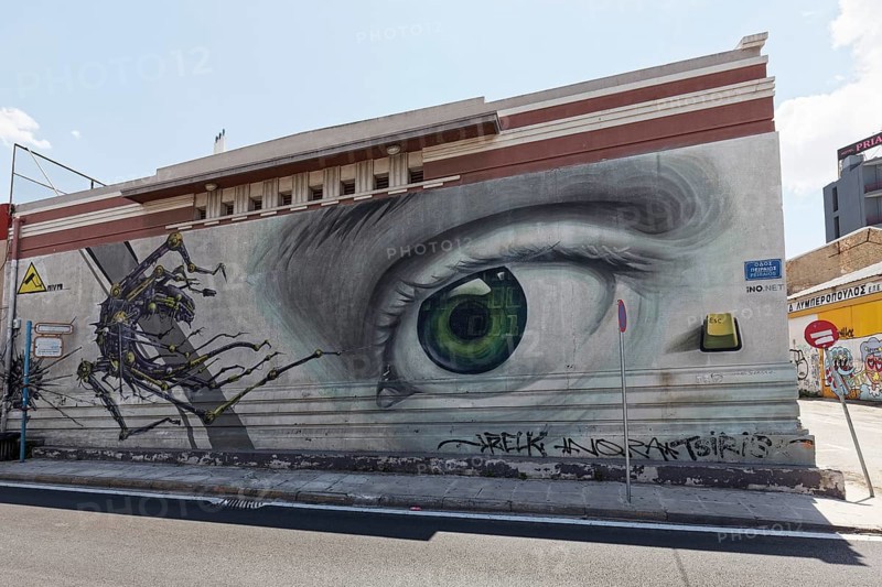 Oversized eye puts monsters to flight, title Access Control, mural by street artists INO & Aiva, Athens, Greece, Europe