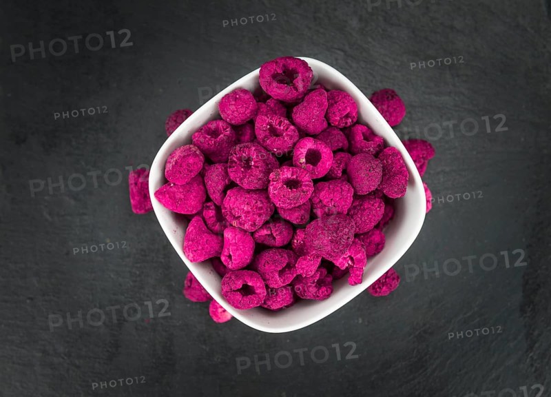 Some homemade Raspberries (dried) as detailed close-up shot, selective focus