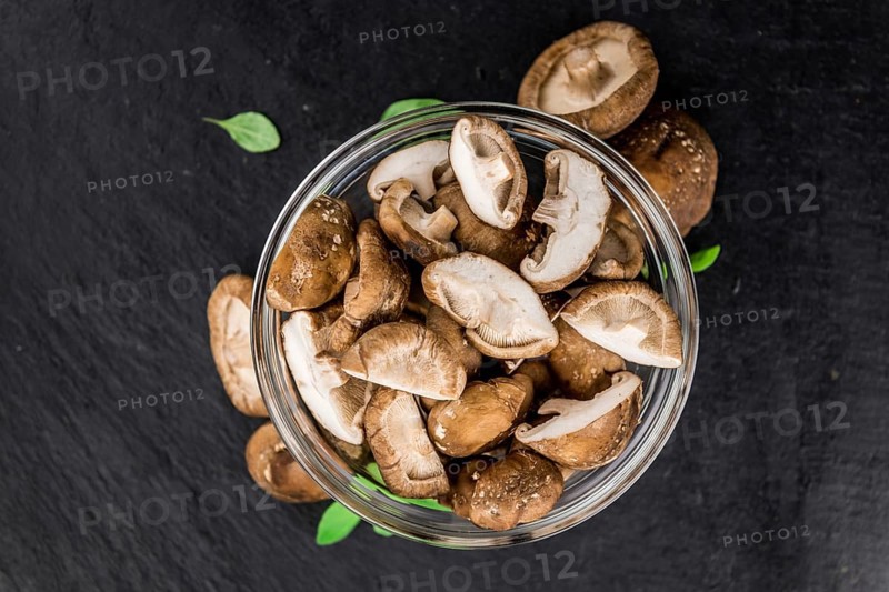 Portion of fresh Shiitake mushrooms close-up shot, selective focus