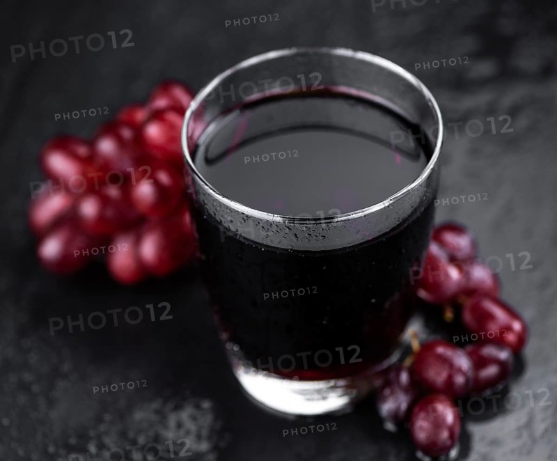 Some fresh Red Grape Juice (selective focus, close-up shot)
