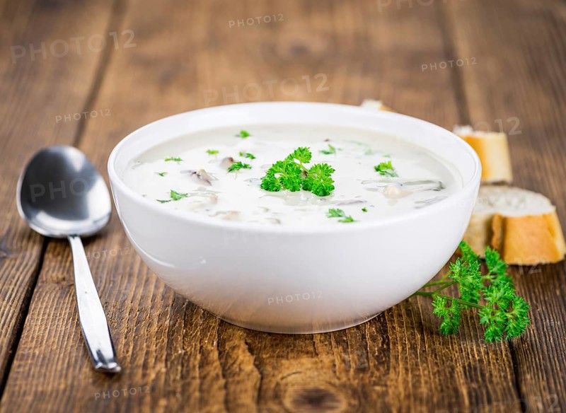 Homemade Porcini Soup on vintage background selective focus, close-up shot