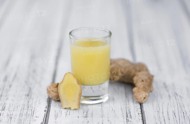 Portion of fresh Ginger Juice (selective focus, close-up shot)