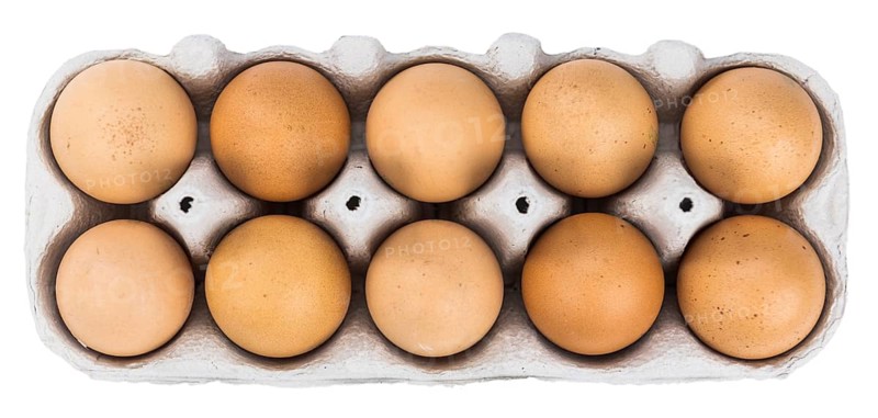 Raw Eggs isolated on white background (selective focus, close-up shot)