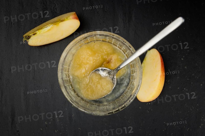 Slate slab with homemade Applesauce (close-up shot, selective focus)