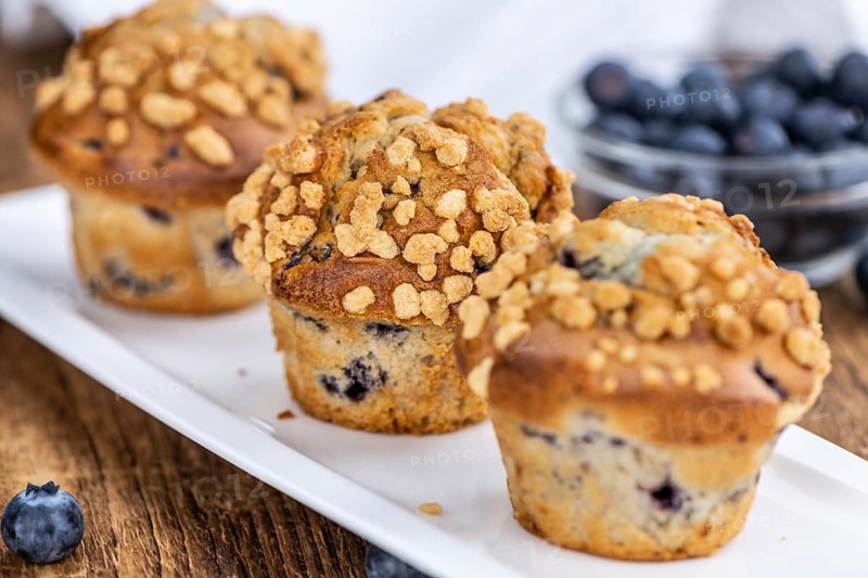 Some fresh Blueberry Muffins (selective focus, close-up shot)