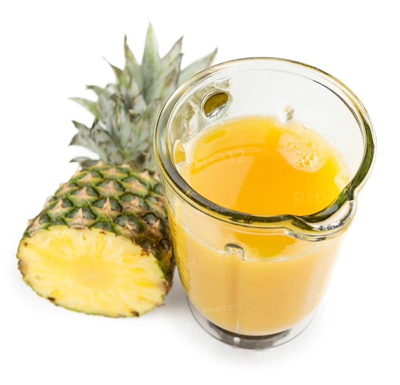 Fresh made Pineapple Juice isolated on white background, close-up shot