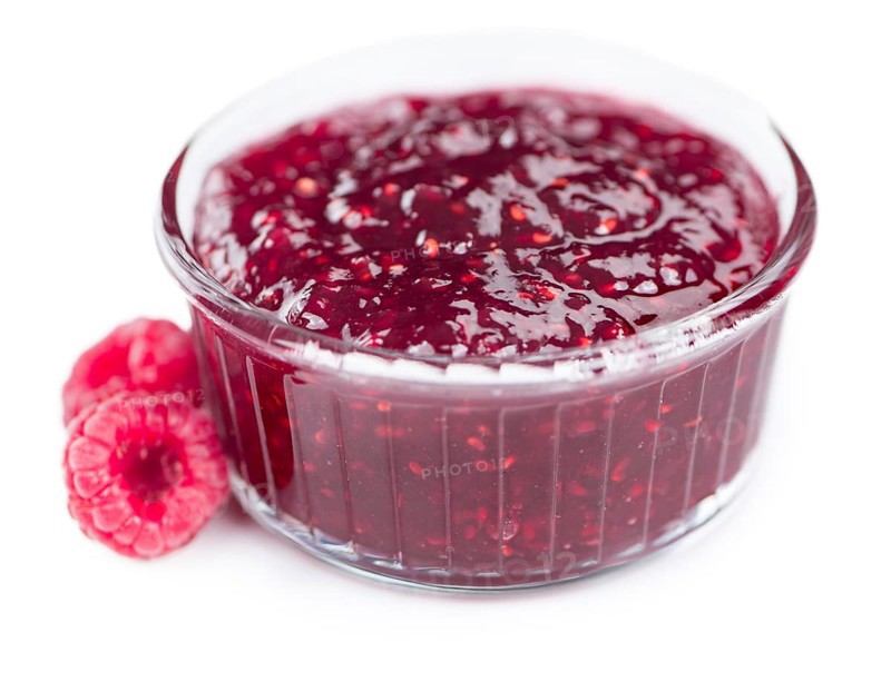 Raspberry Jam isolated on white background, selective focus, close-up shot