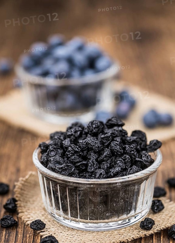 Fresh made Dried Blueberries on an old and rustic wooden table, selective focus, close-up shot