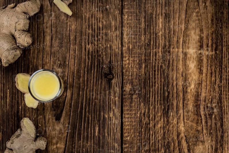 Portion of fresh Ginger Juice (selective focus, close-up shot)