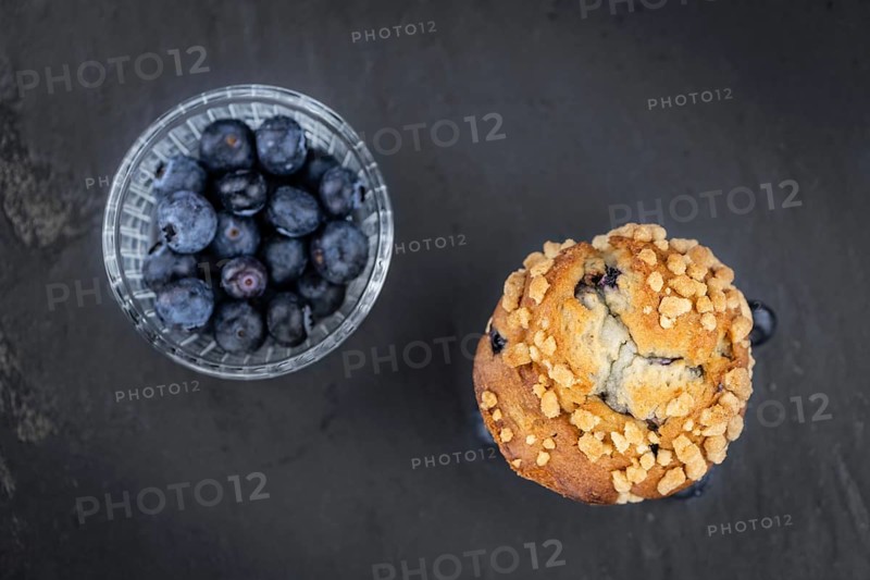 Fresh Blueberry Muffins as detailed close-up shot (selective focus)