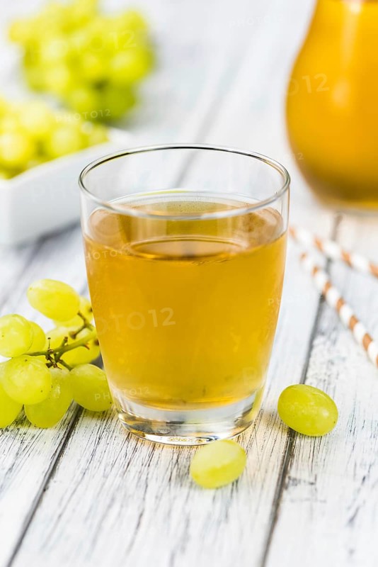 Some healthy Grape Juice (selective focus, close-up shot)