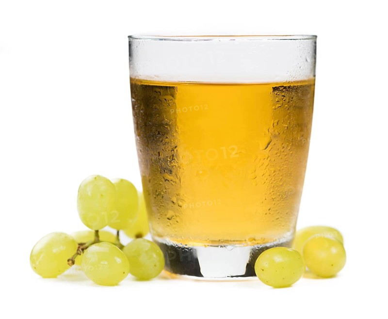 Grape Juice isolated on white background (selective focus, close-up shot)
