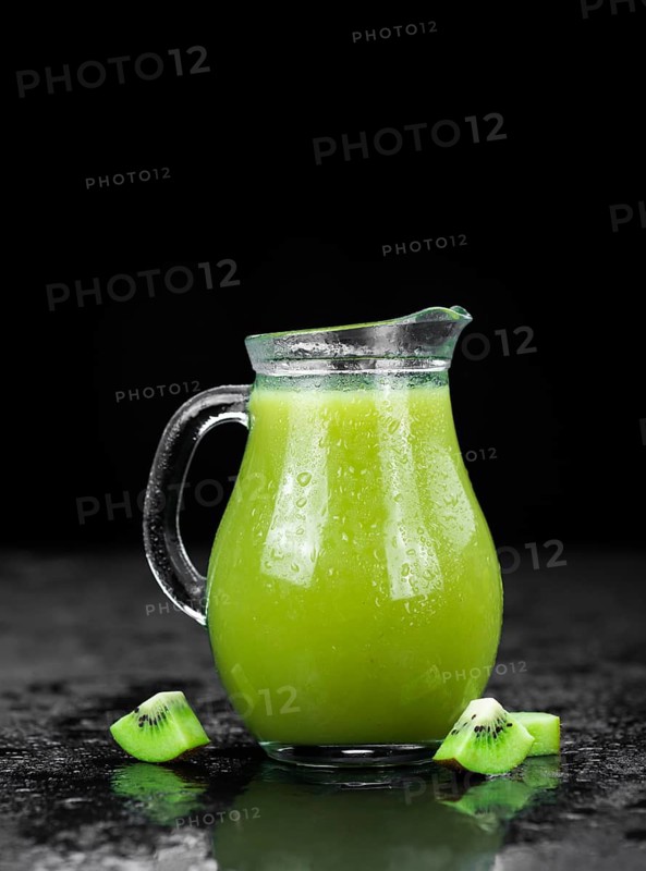 Kiwi Smoothie (selective focus) on an old and vintage background (homemade)