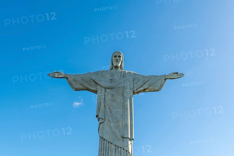 Christ the Redeemer statue in Rio de Janeiro, Brazil with blue sky in the background