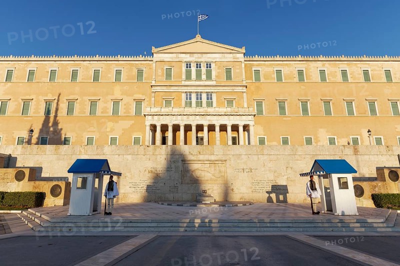 Parliament building with evzones in the evening light, former royal palace, Syntagma Square, Athens, Greece, Europe
