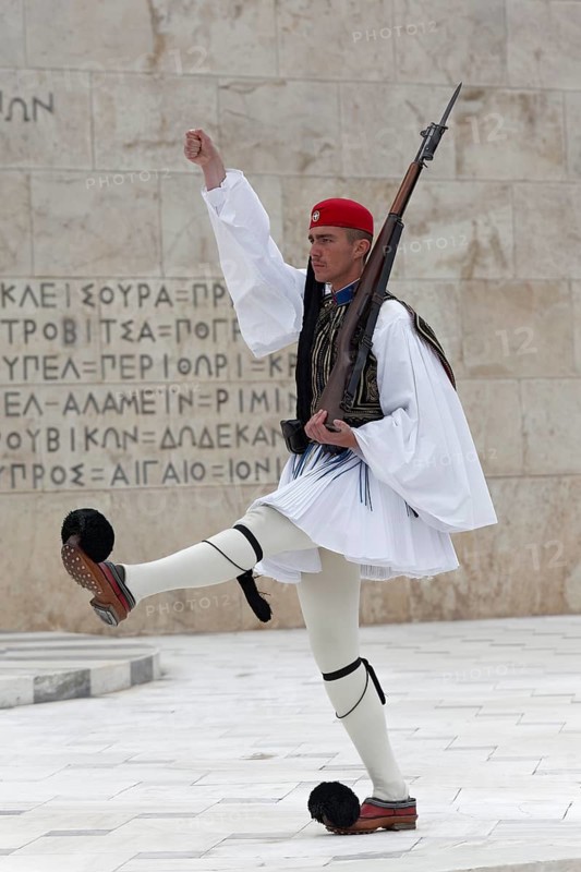 Evzone marching in front of the parliament building, Tomb of the Unknown Soldier, Syntagma Square, Athens, Greece, Europe