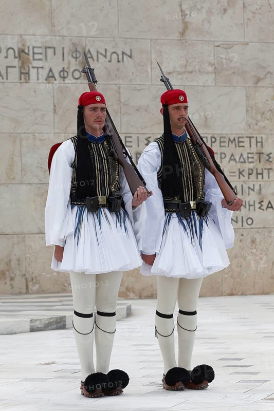 Two Evzones in traditional dress stand guard in front of the parliament building, Tomb of the Unknown Soldier, Syntagma Square, Athens, Greece, Europe