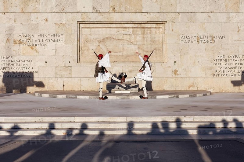 Two Evzones in traditional dress in front of the parliament building, Tomb of the Unknown Soldier, Syntagma Square, Athens, Greece, Europe