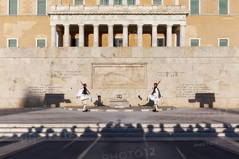 Two Evzones in traditional dress in front of the parliament building, Tomb of the Unknown Soldier, Syntagma Square, Athens, Greece, Europe