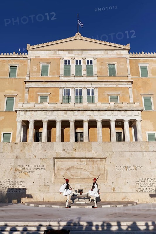 Two Evzones in traditional dress in front of the parliament building, Tomb of the Unknown Soldier, Syntagma Square, Athens, Greece, Europe