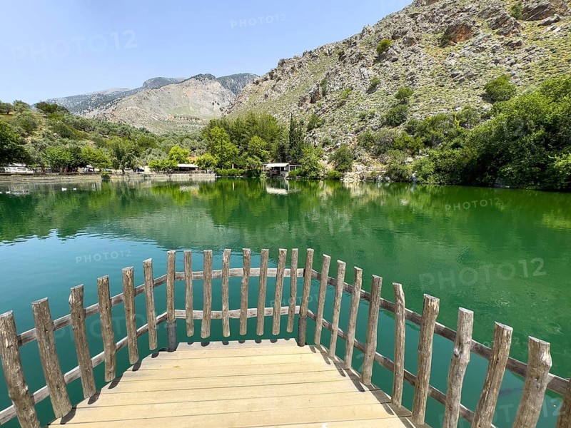 View of the small viewing platform at the front of an artificial lake created in 1987 on the edge of the Psiloritis Mountains and fed by the Votomos spring Votomos Lake Votomos Zaros Lake Zaros Lake Zaros Lake, in the background foothills of the Psiloritis Mountains Psiloritis Massif Ida Mountains, Zaros, Crete, Greece, Europe