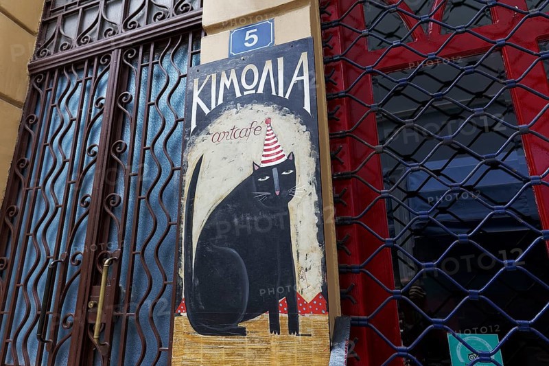 Black cat with hat, original coffee house sign, Kimolia Art Cafe, Plaka neighbourhood, Athens, Greece, Europe