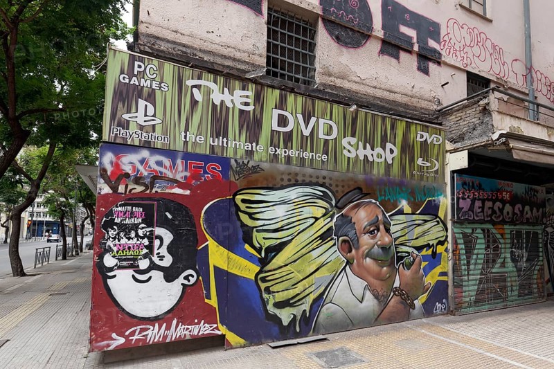 Street corner with portrait of a sprayer on an abandoned shop, street art in Exarchia, neighbourhood of the students and alternative scene, Athens, Greece, Europe