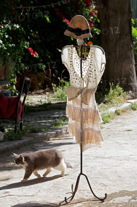 Clothes rack with summer dress in the morning light, placed in front of a fashion boutique, Plaka neighbourhood, Athens, Greece, Europe