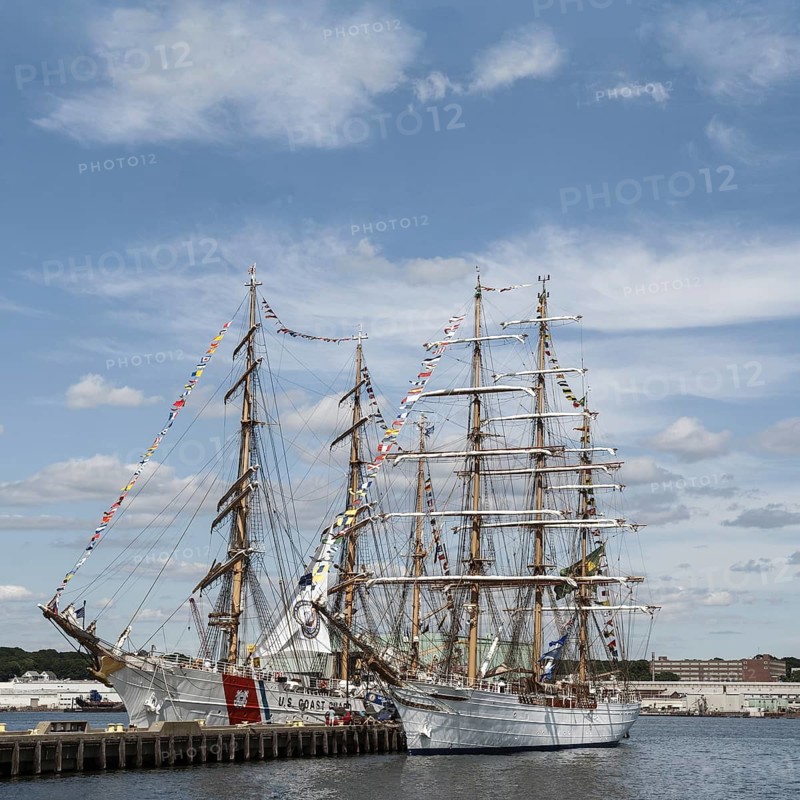 The United States Coast Guard tall ship Eagle and the Brazilian Navy tall ship Cisne Branco, which means White Swan, seen here moored at Fort Trumbull in New London, Connecticut, USA during Operation Sail 2012 aka OpSail 2012, celebrating the bicentennial of the War of 1812 and the penning of the Star Spangled Banner, the US National Anthem. Both tall ships are Class A square-riggers and both act as international envoys for their respective countries and as training vessels (the Eagle for US Coast Guard cadets and the Cisne Branco for the Brazilian navy)