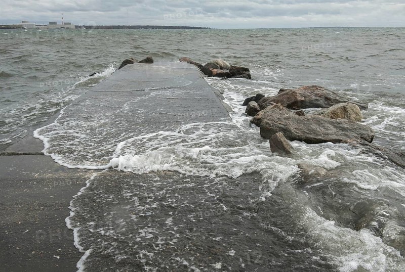 Black Point Beach, Niantic, East Lyme, Connecticut USA 28 Oct 2012: Winds, whitecaps and heavy surf build along the Connecticut shore the day before Hurricane Sandy hit coastal New England. The Millstone Nuclear Power Plant is seen across the bay