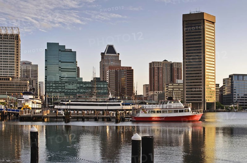 The skyline and boats in the early morning in the inner Harbor, Baltimore Maryland USA