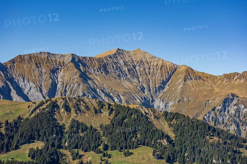 Mountain landscape with wooded slopes and clear peaks under a blue sky, saas Fee, Alps, Switzerland, Europe