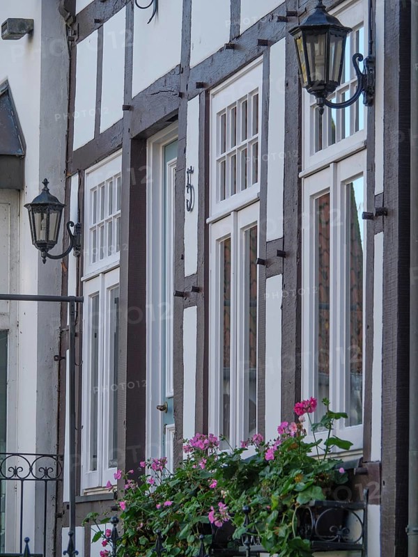 Half-timbered houses with flower boxes and lanterns on the facades, a cosy atmosphere, Tecklenburg, North Rhine-Westphalia, Germany, Europe