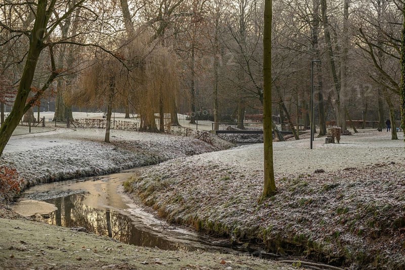 A small stream with a bridge in a frost-covered park landscape in winter morning, Velen, North Rhine-Westphalia, GERMANY
