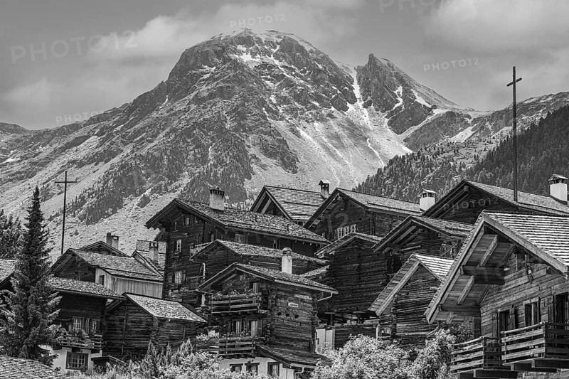 Nested old wooden houses, in the background the summit of the mountain Scex de Marenda, historic village centre, black and white photograph, Grimentz, Val d'Anniviers, Valais Alps, Canton Valais, Switzerland, Europe