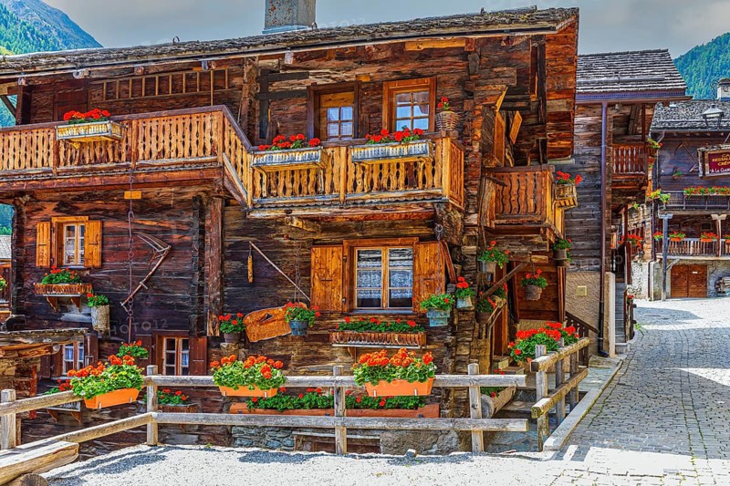Paved footpath surrounded by old wooden houses, flower boxes on balconies and windows, historic village centre, Grimentz, Val d'Anniviers, Valais Alps, Canton Valais, Switzerland, Europe