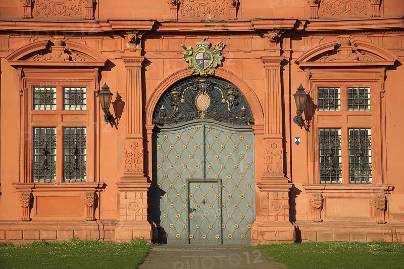Red portal with coat of arms, door with fittings and decorations, baroque, red, Electoral Palace, Old Town, Mainz, Rhine-Hesse region, Rhineland-Palatinate, Germany, Europe